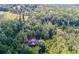 Aerial view of house nestled in a wooded area at 8872 Conners Rd, Villa Rica, GA 30180