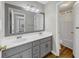 Main bathroom with double sinks and a separate toilet area at 1151 Ruby Nelson Ct, Lawrenceville, GA 30043