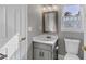 Updated bathroom with vanity and decorative window at 1151 Ruby Nelson Ct, Lawrenceville, GA 30043