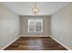 Spacious bedroom featuring wood-look floors and a ceiling fixture at 1151 Ruby Nelson Ct, Lawrenceville, GA 30043
