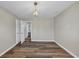 Charming bedroom with wood-look floors, access to bathroom, and neutral walls at 1151 Ruby Nelson Ct, Lawrenceville, GA 30043