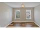 Bright bedroom with hardwood floors and neutral walls at 1151 Ruby Nelson Ct, Lawrenceville, GA 30043