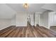 Bright bedroom with wood-look floors and access to other rooms at 1151 Ruby Nelson Ct, Lawrenceville, GA 30043