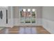 Spacious dining room with hardwood floors and a view of the backyard at 1151 Ruby Nelson Ct, Lawrenceville, GA 30043