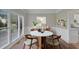 Modern dining room with hardwood floors and large windows at 1151 Ruby Nelson Ct, Lawrenceville, GA 30043