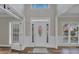 Bright and spacious entryway with hardwood floors and an elegant door at 1151 Ruby Nelson Ct, Lawrenceville, GA 30043