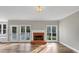 Gathering room with brick fireplace and hardwood floors at 1151 Ruby Nelson Ct, Lawrenceville, GA 30043