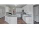 Modern kitchen with white cabinets and large island at 1151 Ruby Nelson Ct, Lawrenceville, GA 30043