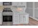 Stainless steel appliances and white cabinetry in this updated kitchen at 1151 Ruby Nelson Ct, Lawrenceville, GA 30043