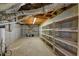 Unfinished basement with shelving for ample storage at 1151 Ruby Nelson Ct, Lawrenceville, GA 30043