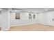 Spacious finished basement featuring light gray walls and new flooring at 2128 Hosea L Williams Ne Dr, Atlanta, GA 30317