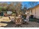 Charming backyard patio with seating area and gravel landscaping at 1404 Cassville Nw Rd, Cartersville, GA 30121