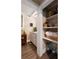 Small bathroom with white cabinets and linen closet at 1404 Cassville Nw Rd, Cartersville, GA 30121