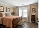 Cozy bedroom with hardwood floors and a charming antique bed at 1404 Cassville Nw Rd, Cartersville, GA 30121