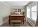 Charming bedroom with antique bed and neutral decor at 1404 Cassville Nw Rd, Cartersville, GA 30121