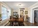 Farmhouse style dining room with wooden table and access to kitchen and pantry at 1404 Cassville Nw Rd, Cartersville, GA 30121