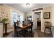 Farmhouse style dining room with wooden table and access to kitchen and pantry at 1404 Cassville Nw Rd, Cartersville, GA 30121
