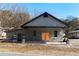 Charming renovated building with a covered carport and large wooden doors at 1404 Cassville Nw Rd, Cartersville, GA 30121