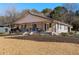 Charming ranch home with a spacious front porch and well-manicured landscaping at 1404 Cassville Nw Rd, Cartersville, GA 30121