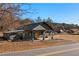 Renovated building with large doors, sitting on a landscaped lot at 1404 Cassville Nw Rd, Cartersville, GA 30121