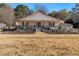 Charming ranch home with a spacious front porch and well-manicured landscaping at 1404 Cassville Nw Rd, Cartersville, GA 30121
