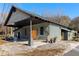 Gray renovated building with a covered carport and large wooden doors at 1404 Cassville Nw Rd, Cartersville, GA 30121
