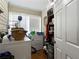 Convenient laundry room with washer, dryer, and storage shelves at 1404 Cassville Nw Rd, Cartersville, GA 30121