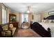 Large main bedroom with king-size bed and sitting area at 1404 Cassville Nw Rd, Cartersville, GA 30121