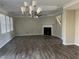 Bright living room featuring hardwood floors and a fireplace at 677 Leaflet Ives Trl, Lawrenceville, GA 30045