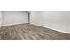 Spacious finished basement with wood-look tile flooring at 1730 Salina Dr, Jonesboro, GA 30236
