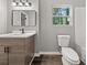 Modern bathroom with new vanity and fixtures at 1730 Salina Dr, Jonesboro, GA 30236