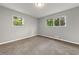 Well-lit bedroom with new carpet and neutral walls at 1730 Salina Dr, Jonesboro, GA 30236