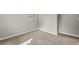 Neutral gray bedroom with carpeted floors and multiple doors at 1730 Salina Dr, Jonesboro, GA 30236