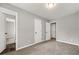 Neutral bedroom with gray walls, carpet, and multiple doors at 1730 Salina Dr, Jonesboro, GA 30236