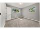 Bright bedroom featuring new carpet and large windows at 1730 Salina Dr, Jonesboro, GA 30236