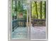 View of backyard deck through sliding glass doors at 1730 Salina Dr, Jonesboro, GA 30236