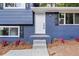 Front entrance with steps leading to a newly painted blue home at 1730 Salina Dr, Jonesboro, GA 30236