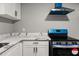 Modern kitchen with white cabinets and quartz countertops at 1730 Salina Dr, Jonesboro, GA 30236