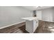 Kitchen island with white cabinets and quartz countertop at 1730 Salina Dr, Jonesboro, GA 30236