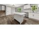 Modern kitchen with white cabinets and a large island at 1730 Salina Dr, Jonesboro, GA 30236