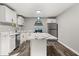 Modern kitchen with white cabinets, quartz countertops, and stainless steel appliances at 1730 Salina Dr, Jonesboro, GA 30236