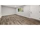 Living room with gray walls and wood-look tile floors at 1730 Salina Dr, Jonesboro, GA 30236