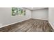 Living room with gray walls and wood-look tile floors at 1730 Salina Dr, Jonesboro, GA 30236