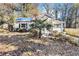 Front yard of house with covered porch, palm tree, and shrubs at 1882 Brannen Se Rd, Atlanta, GA 30316