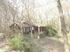 Brown Ranch house nestled among the trees at 295 Hiram Acworth Hwy, Hiram, GA 30141