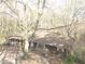 Ranch house with brown siding and large tree in front at 295 Hiram Acworth Hwy, Hiram, GA 30141