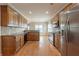 Open concept kitchen with granite countertops and stainless steel appliances at 1032 Richmond Place Way, Loganville, GA 30052