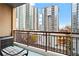 Private balcony overlooks city views with a chair for relaxing at 1101 Juniper Ne St # 301, Atlanta, GA 30309