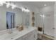 Bathroom with double vanity, glass shower, and white subway tile at 1682 Gunnin Nw Trce # 250, Atlanta, GA 30318