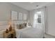 Bright bedroom with a plush bed and neutral decor at 1682 Gunnin Nw Trce # 250, Atlanta, GA 30318